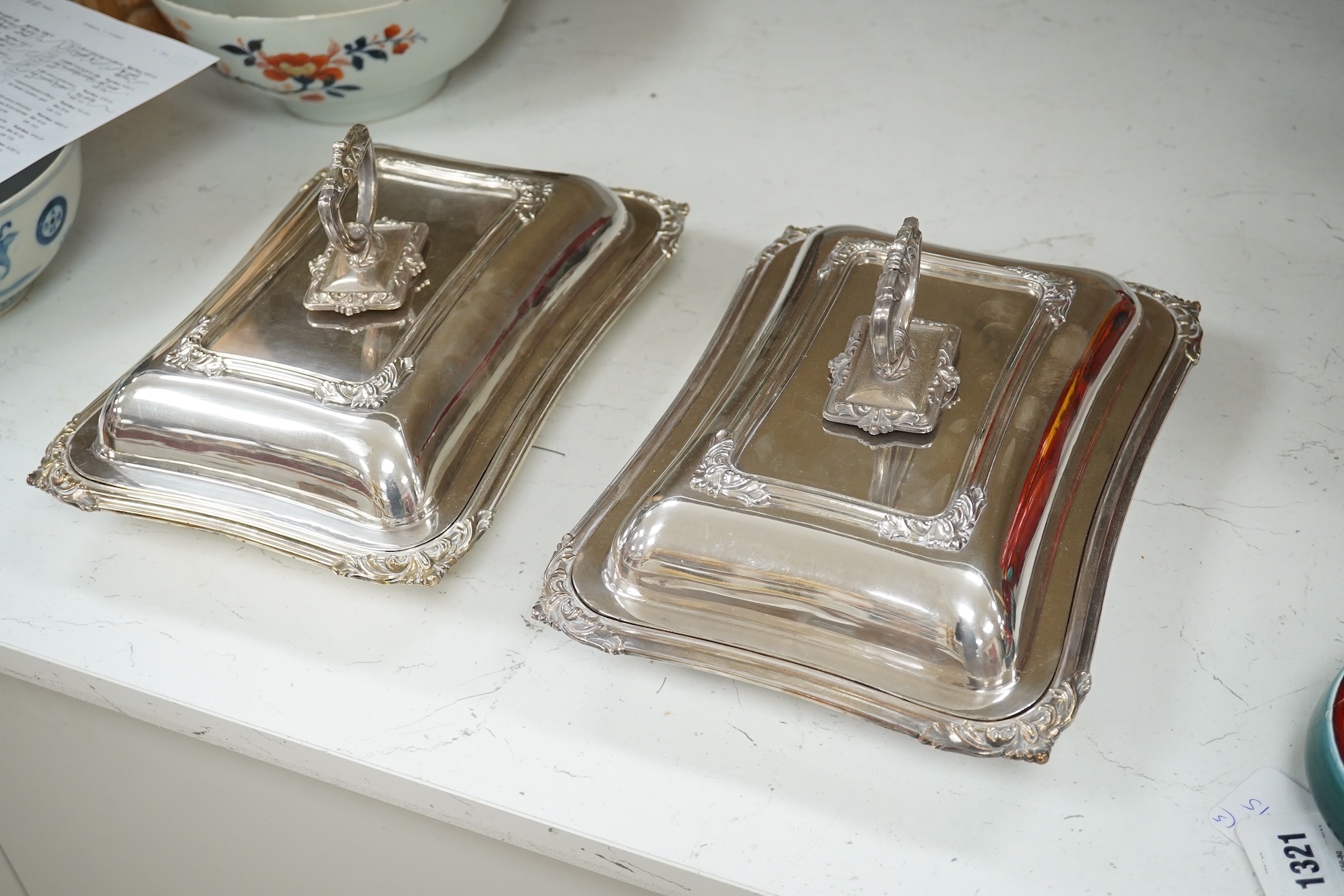 A pair of electroplate entrée dishes and covers, 30cm. Condition - fair to good